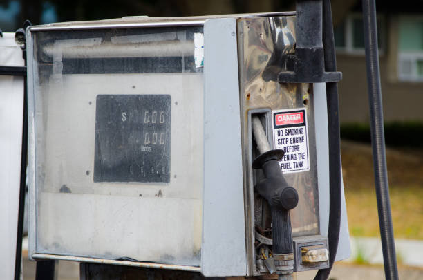 Old petrol pump fuel dispenser is a machine at a filling station that is used to pump gasoline (petrol), diesel, close-up in white color