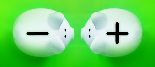 two piggy bank facing each other with very different saving strategies