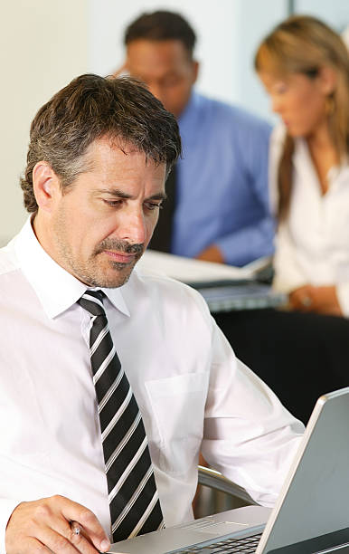 istock businessman with a laptop 157289912