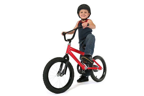 Boy Sitting On Bike stock photo