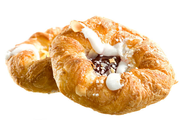 Danish pastry on white background Delicious pastry isolated on white. baked pastry item stock pictures, royalty-free photos & images