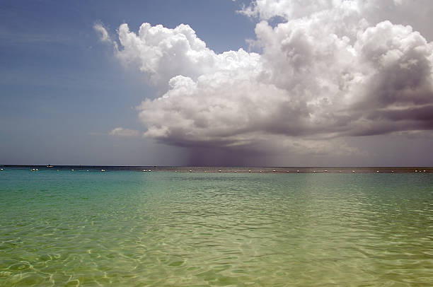 Caribbean Sun Shower Roatan Island Honduras  Microburst stock pictures, royalty-free photos & images