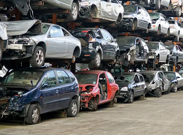 Rows of scrap cars awaiting recycling