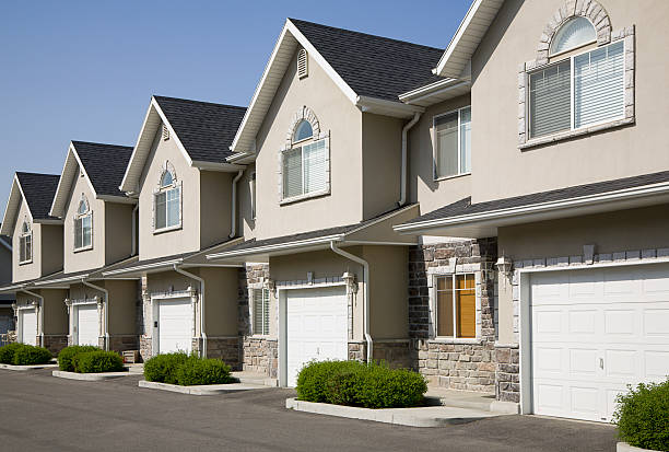 A row of townhouses with blue sky.