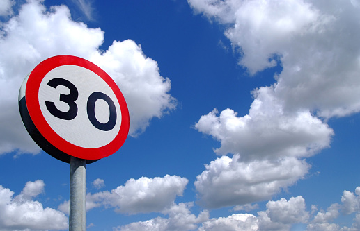 speed limit sign under blue sky