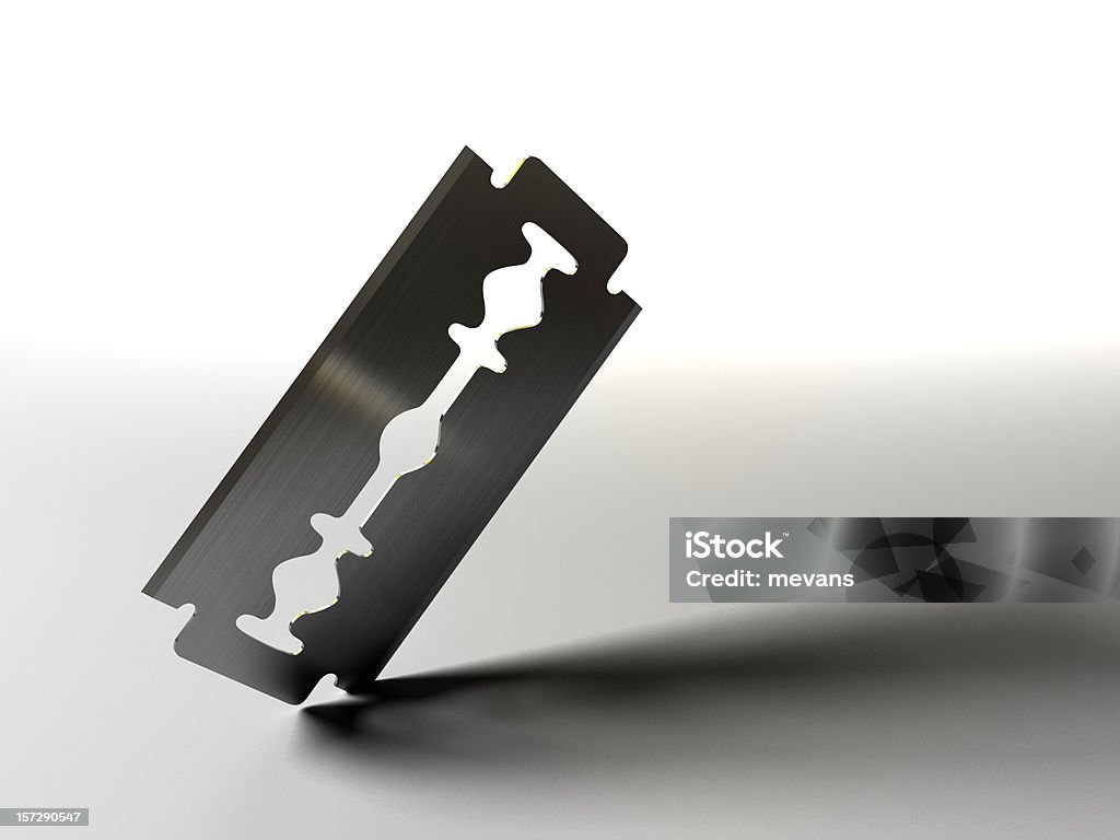 Razor blade on white background A razor blade cutting into a surface. 3D render with HDRI lighting and raytraced textures. Razor Blade Stock Photo