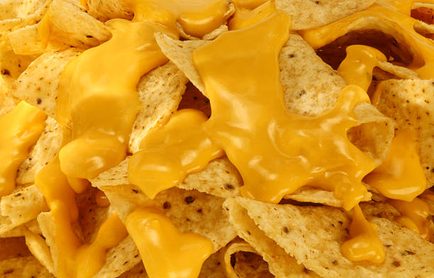 Nachos and Melted Cheese. Restaurant style nachos and melted cheese. nacho chip stock pictures, royalty-free photos & images