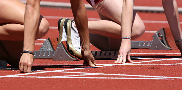 istock People at the starting line on a race track 157292123