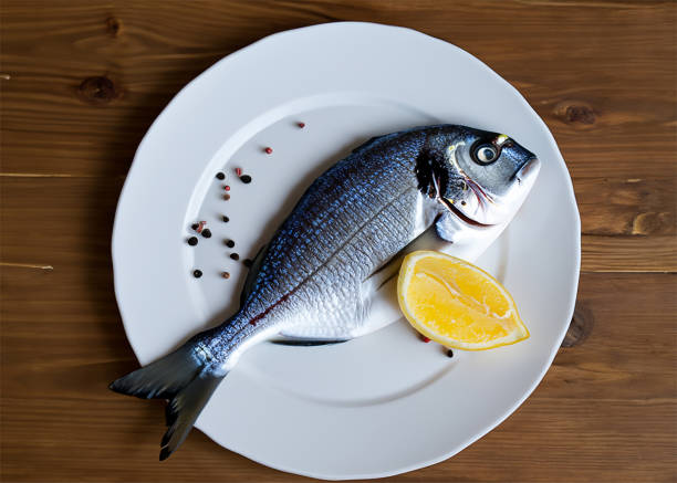istock Image of a  fish with citrus 1572921917