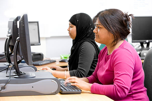 istock adult education: two South Asian mature students working together 157292592