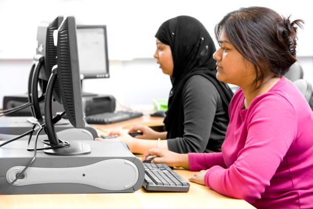 istock adult education: South Asian students researching online for class 157292611