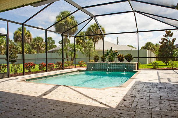 Pool with screen enclosure  enclosure stock pictures, royalty-free photos & images