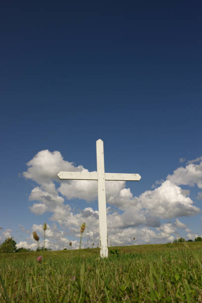 istock Cross in the field 157293177