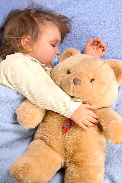 istock Kid slipping with Teddy Bear 157293238