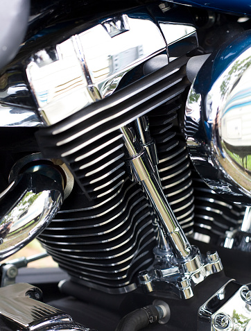 A close up of a chrome motorcycle engine.
