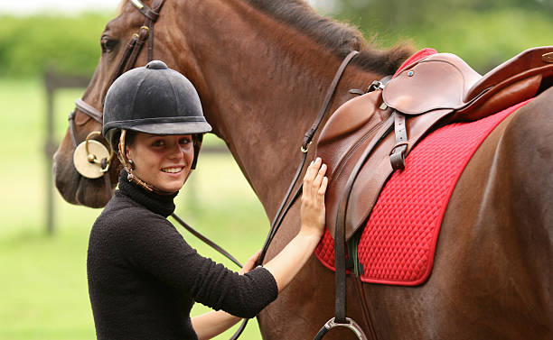 istock Girl getting ready for horseback riding, Norway 157293448