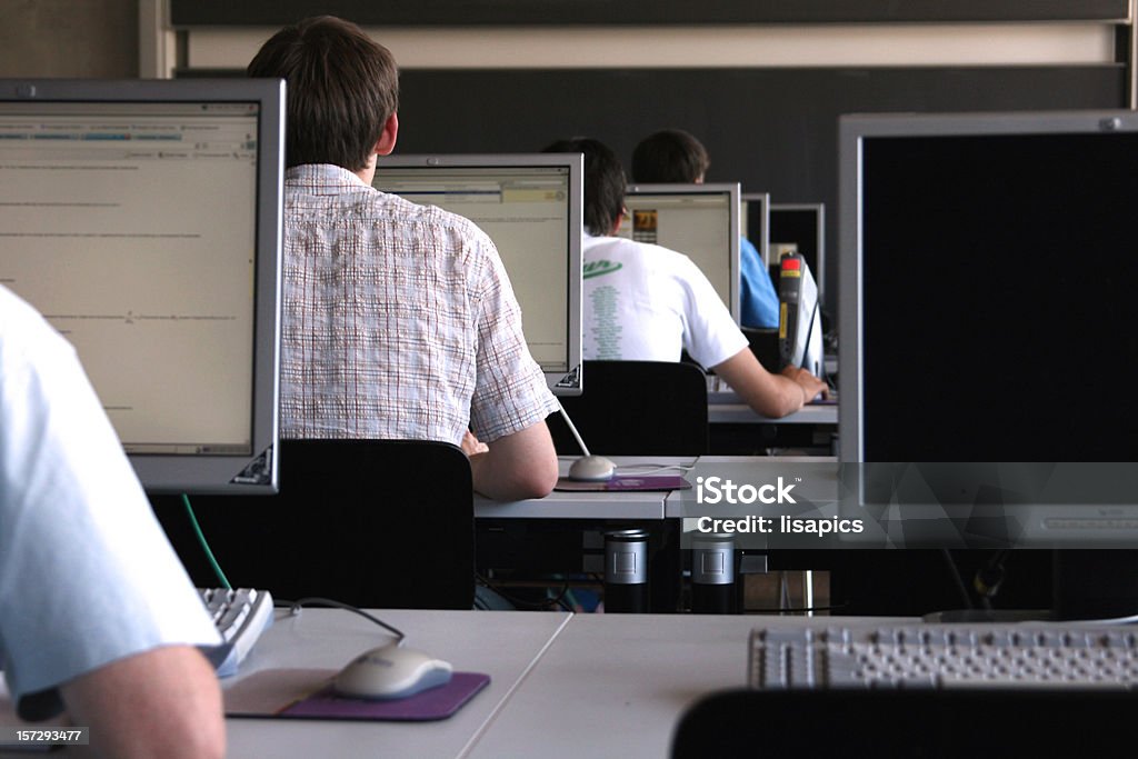 Students learning in a computer room at university.  Student Stock Photo