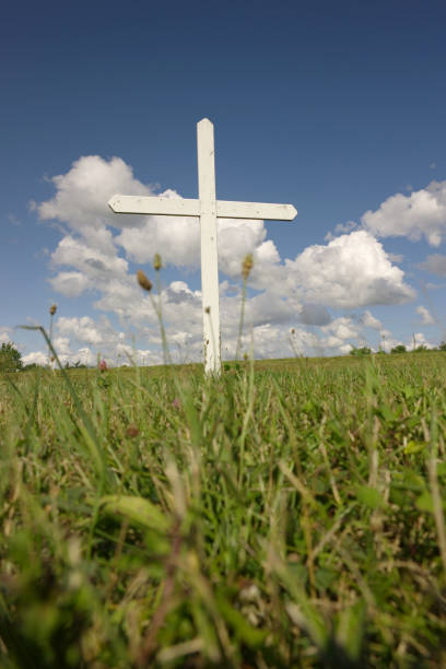 istock Cross in the field 157293589
