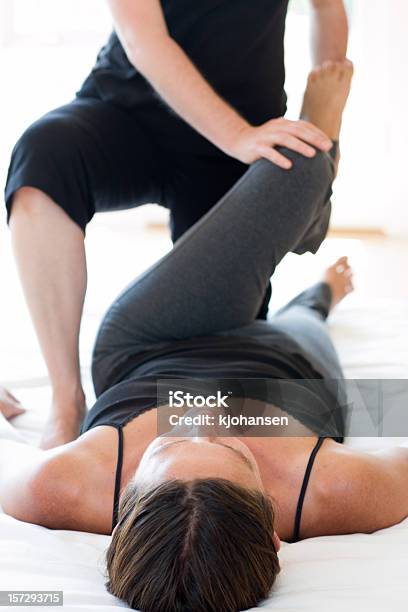 Physical Therapy Stock Photo - Download Image Now - 30-34 Years, 30-39 Years, 35-39 Years