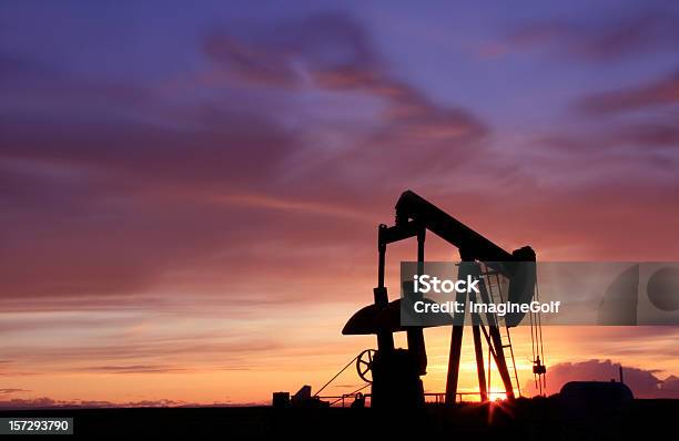 Silhouette Of An Oil Industry Pumpjack In Canada Stock Photo - Download Image Now - Lever, Cloud - Sky, Color Image