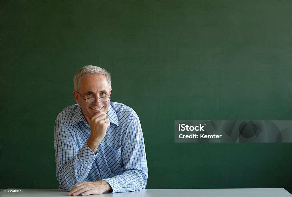 smiling teacher  Chalkboard - Visual Aid Stock Photo