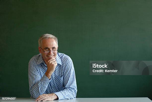 Smiling Teacher Stock Photo - Download Image Now - Chalkboard - Visual Aid, White Hair, 40-49 Years