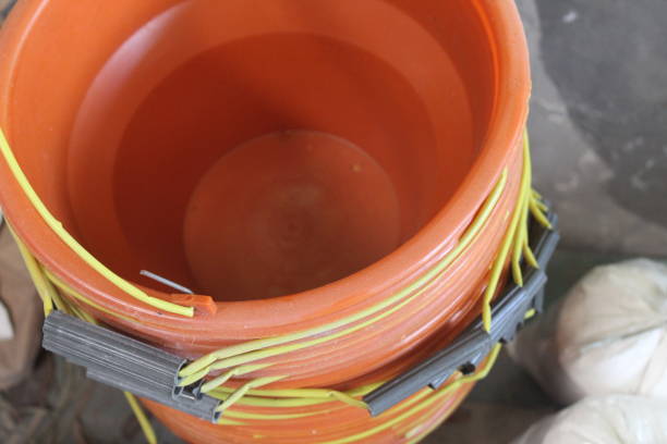 istock pile of orange plastic buckets 1572942251