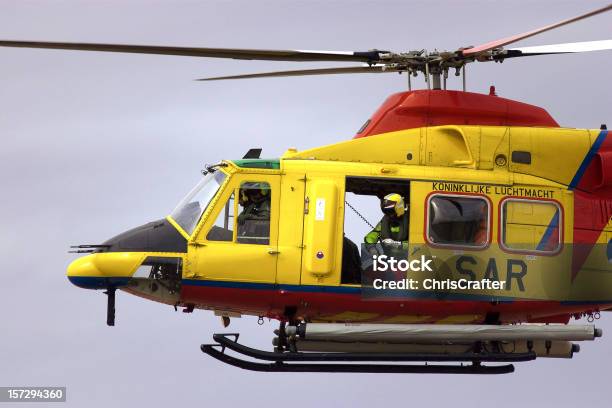 Search And Rescue Helicopter With Winch Man Stock Photo - Download Image Now - Charity and Relief Work, Activity, Color Image