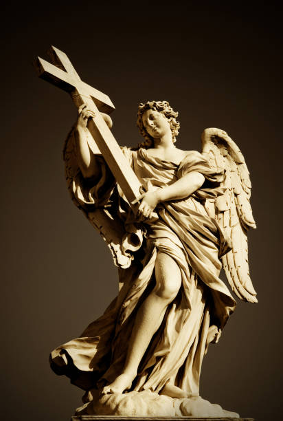 istock angel with the cross 157294520
