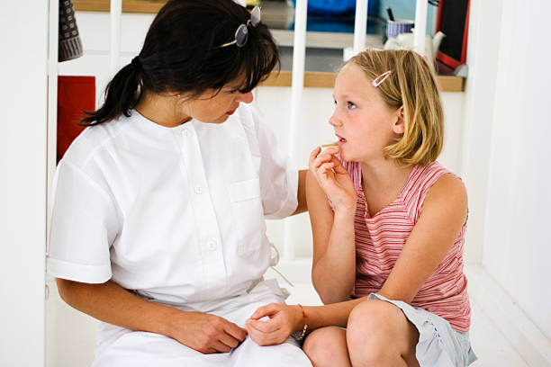 istock Little girl with a doctor 157294621