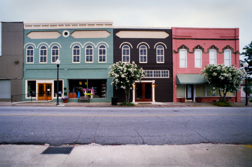 Eufaula, Alabama, USA - August 13, 2022: Dramatic view of historic buildings in downtown Eufaula in golden hour lighting.