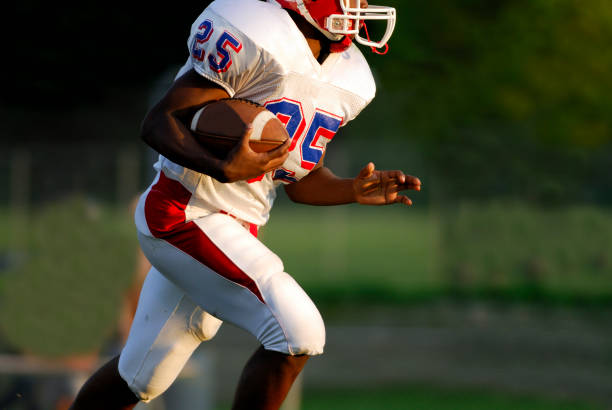 istock American football running back. 157295173