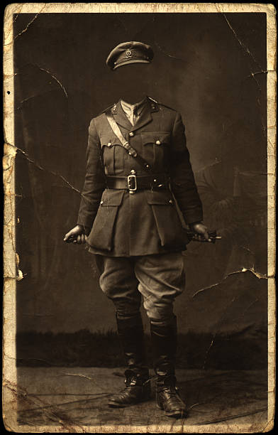 old faceless soldier pose an old faded worn and creased photograph of a soldier with face blanked out war photos stock pictures, royalty-free photos & images