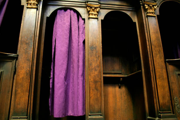 a catholic confession booth with a purple curtain - st vitus katedrali stok fotoğraflar ve resimler