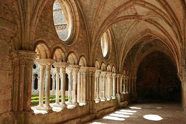 Horizontal image of medieval architecture with no activity Medieval abbey corridor. Copy space. cloister stock pictures, royalty-free photos & images