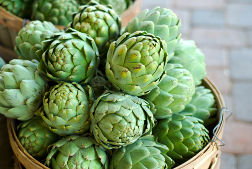 Concept of healthy food with artichoke plant