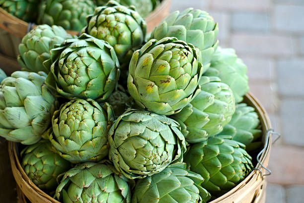 Artichokes Baskets, Fresh Spring Vegetables Food at Farmer's Market  artichoke stock pictures, royalty-free photos & images