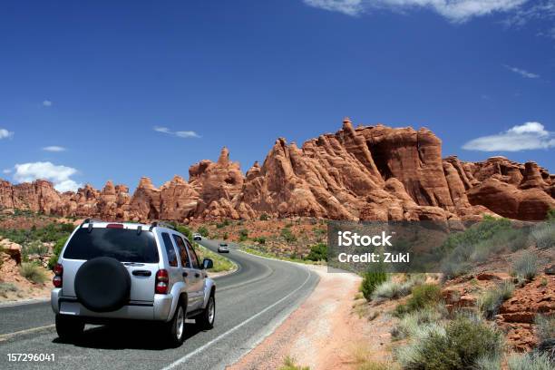 Car Traveling In Arches National Park Stock Photo - Download Image Now - 4x4, Utah, Arches National Park