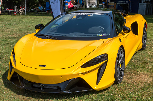 Pittsburgh, Pennsylvania, USA July 22, 2023 The Pittsburgh Vintage Gran Prix in Schenley Park, a yearly event since 1983 featuring car shows and circuit races. A yellow McClaren on display