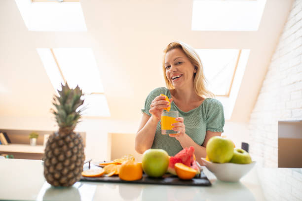 istock Woman eating a healthy breakfast 1572971151