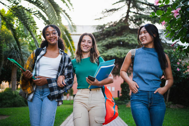istock Three happy college student girls 1572981562