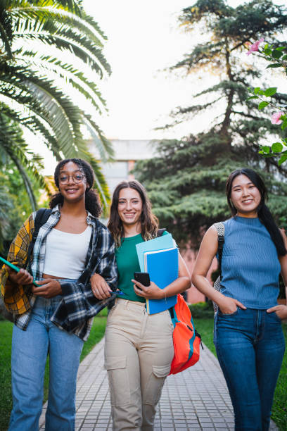 istock Three happy college student girls 1572981564