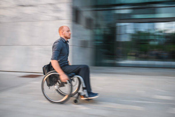 istock Disabled White Collar Worker Commuting In The City 1573007278