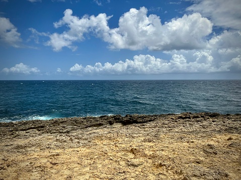 View of a wild seaside in the French Caribbean. Photo taken in Guadeloupe in July 2022