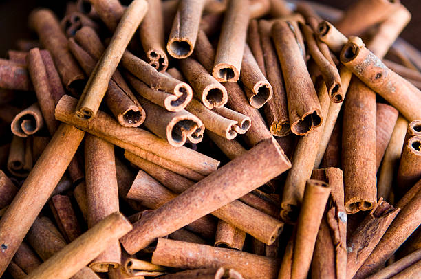 Cinnamon sticks Cinnamon is a spice obtained from the inner bark of several trees from the genus Cinnamomum that is used in both sweet and savoury foods. Cinnamon trees are native to South East Asia, and its origin was a mystery to Europeans until the sixteenth century. cinnamon photos stock pictures, royalty-free photos & images
