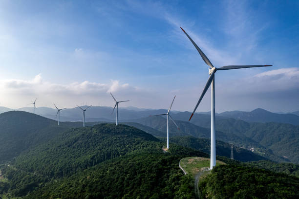 istock On a sunny day, wind turbines on forested mountains 1573026886