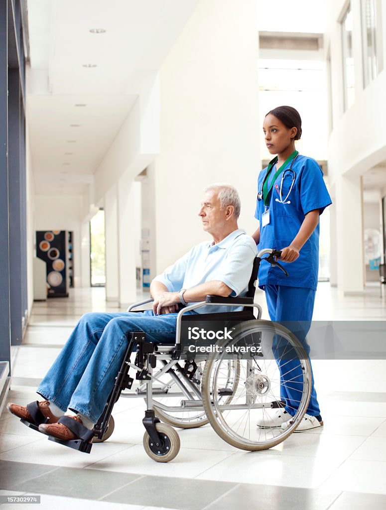 Nurse helping a patient in wheelchair Nurse helping a patient in wheelchairhttp://www.zweig-industries.de/bilder/lightbox-istock/hhp5hospital.jpg African Ethnicity Stock Photo