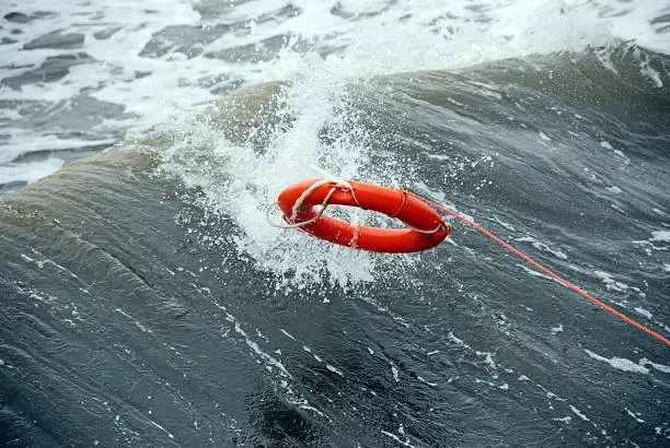Photo of A life preserver being thrown into the water