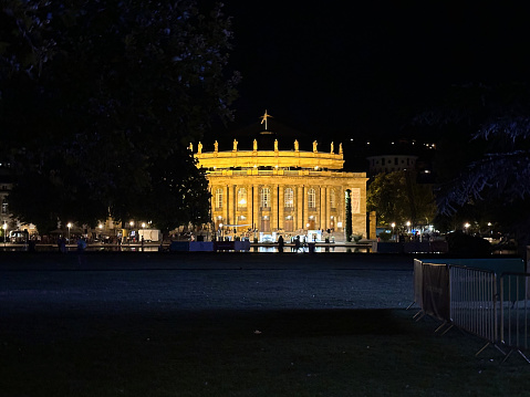 Stuttgart, Germany, July 22, 2023 - The State Theaters / Stuttgart State Opera in the Upper Palace Garden at dusk