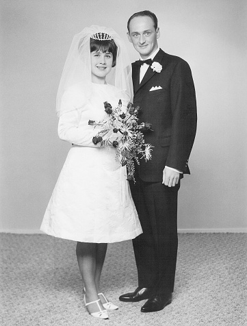 Vintage portrait of a caucasian couple on their wedding day back in 1966.